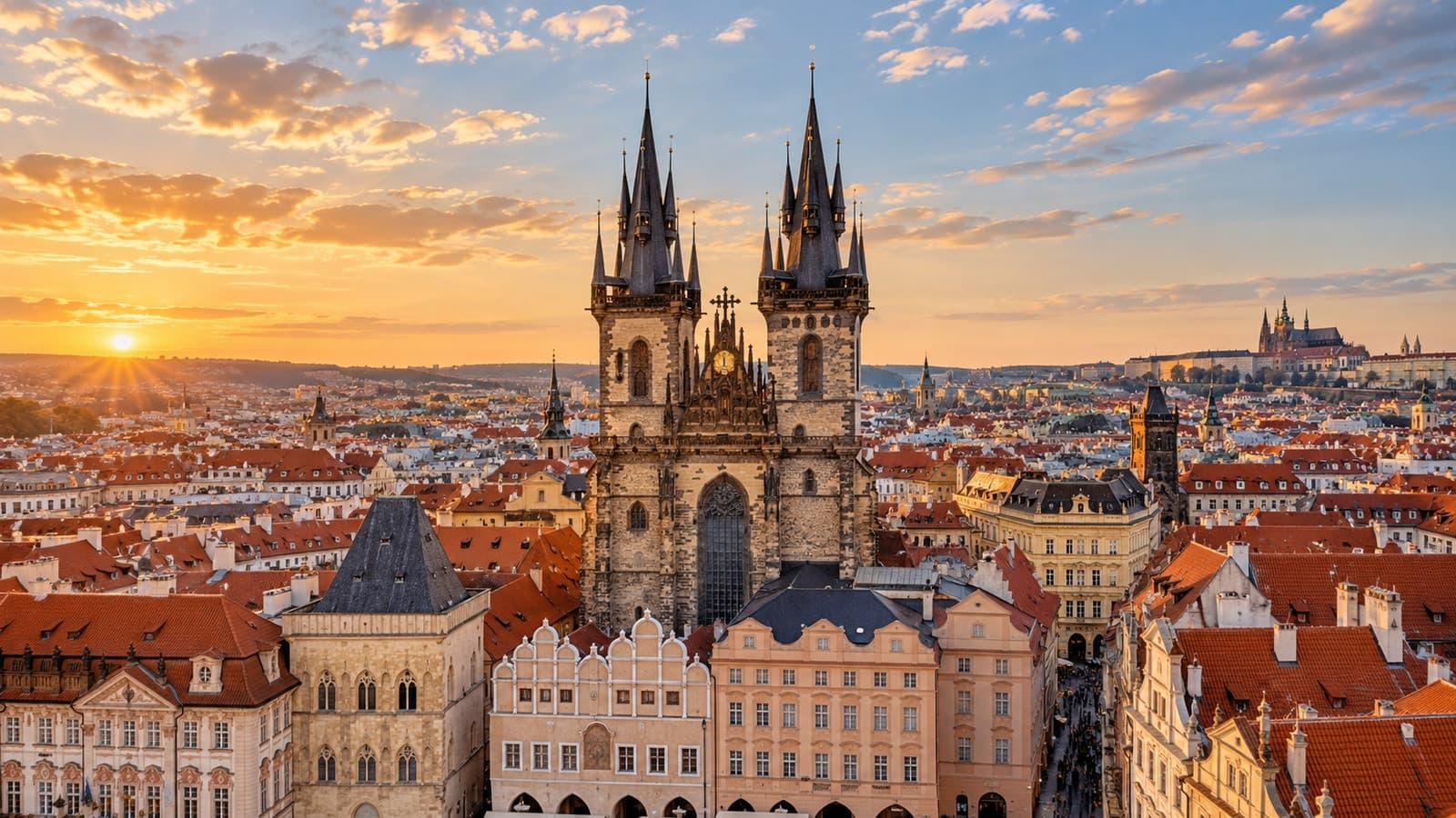 Prague historic terracotta rooftops and Gothic church spires